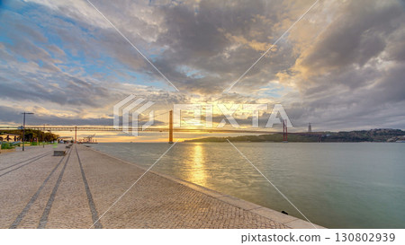 Lisbon city sunrise with April 25 bridge timelapse 130802939