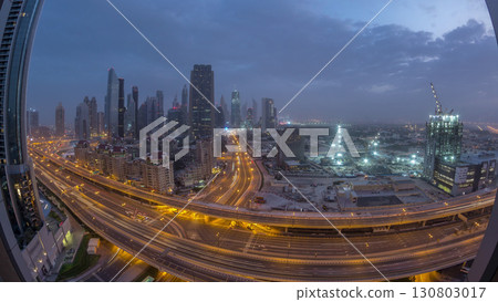 Dubai downtown skyline night to day aerial timelapse with traffic on highway 130803017