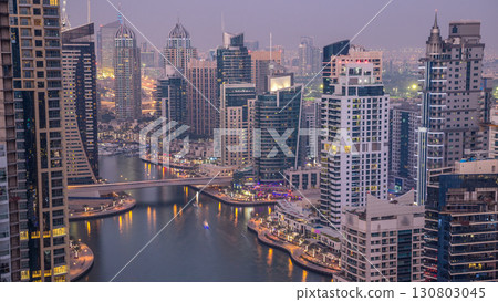 Beautiful aerial top view day to night transition timelapse of Dubai Marina canal 130803045