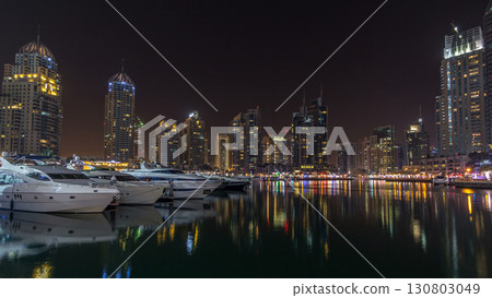 Dubai marina bay with yachts an boats night timelapse hyperlapse Dubai marina bay with yachts an boats night timelapse hyperlapse 130803049