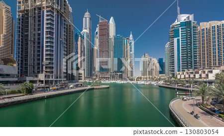 Panoramic view with modern skyscrapers and yachts of Dubai Marina timelapse hyperlapse, United Arab Emirates 130803054