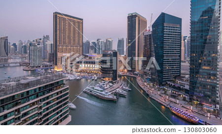 Beautiful aerial top view day to night transition timelapse of Dubai Marina canal 130803060
