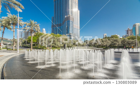 Fountains near main entrance to the tallest skyscraper timelapse hyperlapse, Dubai 130803089