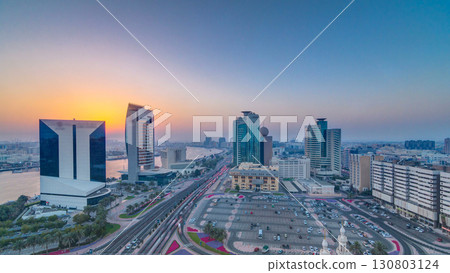 Dubai creek landscape at sunset timelapse with boats and ship near waterfront Dubai creek landscape at sunset timelapse with boats and ship near waterfront 130803124