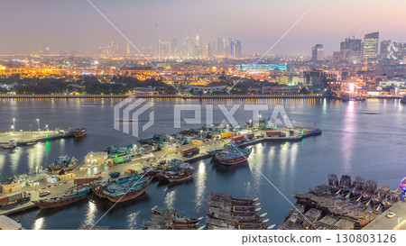 Dubai creek landscape day to night timelapse with boats and ship near waterfront Dubai creek landscape day to night timelapse with boats and ship near waterfront 130803126
