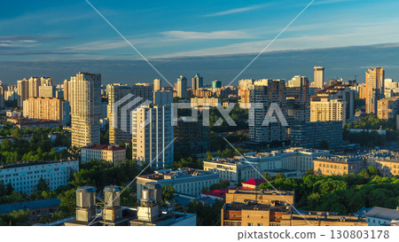 Moscow city bathed in yellow sun at dawn timelapse. An early foggy morning. Shadows moving on houses. 130803178