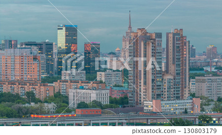Aerial view to cityscape skyline with World Trade Center towers and hotel Ukraine day to night timelapse in Moscow, Russia. 130803179