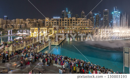The bridge near the biggest musical fountain in Dubai night timelapse. Dubai, UAE 130803193