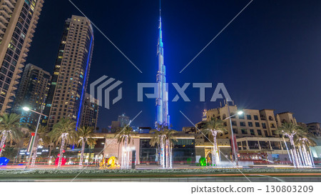 View on modern skyscrapers and busy evening road timelapse hyperlapse in luxury Dubai city, Dubai downtown, United Arab Emirates 130803209