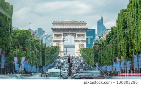 Arc de Triomphe viewed up the Champs Elysees with traffic timelapse. Paris, France 130803286