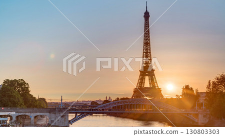 Eiffel Tower sunrise timelapse with boats on Seine river and in Paris, France. 130803303