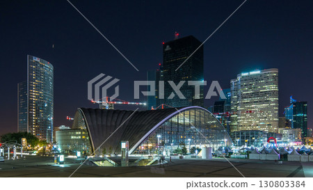 Panorama of illuminated skyscrapers timelapse in famous financial and business district of Paris - La Defense. Panorama of illuminated skyscrapers timelapse in famous financial and business district of Paris - La Defense. 130803384