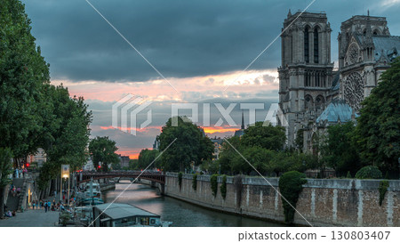 Cathedral Notre Dame de Paris day to night timelapse after sunset in Paris, France. 130803407