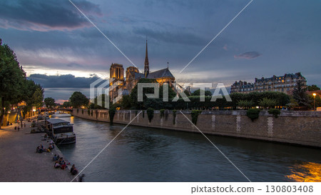 Cathedral Notre Dame de Paris day to night timelapse after sunset in Paris, France. 130803408