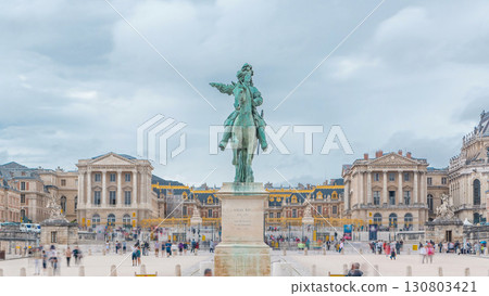 Parade ground of the castle of Versailles with the equestrian statue of Louis XIV timelapse. 130803421