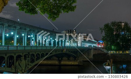 View of pont de Bir-Hakeim night timelapse - a bridge that crosses the Seine River. Paris, France View of pont de Bir-Hakeim night timelapse - a bridge that crosses the Seine River. Paris, France 130803426