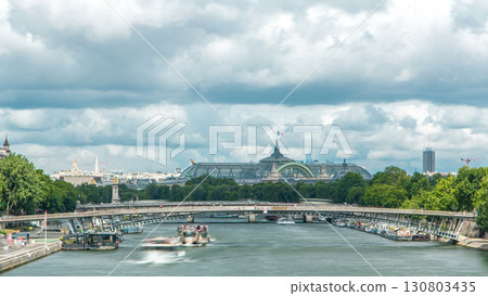 View of the Grand Palais exhibition hall and boats on the Seine River as seen from Royal bridge timelapse. 130803435