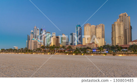 Modern skyscrapers day to night timelapse in jumeirah beach residence in Dubai, JBR 130803485