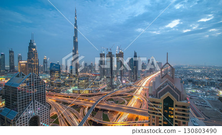 Modern skyscrapers and busy evening highways day to night timelapse in luxury Dubai city, Dubai, United Arab Emirates Modern skyscrapers and busy evening highways day to night timelapse in luxury Dubai city, Dubai, United Arab Emirates 130803490