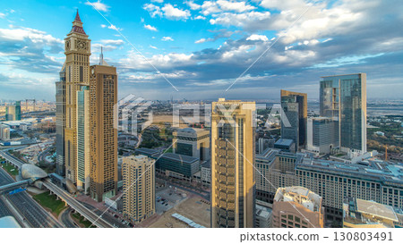 Dubai skyscrapers timelapse evening sunset time. Dubai Metro station and traffic on Sheikh Zayed Road Dubai skyscrapers timelapse evening sunset time. Dubai Metro station and traffic on Sheikh Zayed Road 130803491