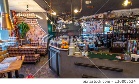 Modern cafe interior with counter and wooden tables with chairs timelapse 130803524