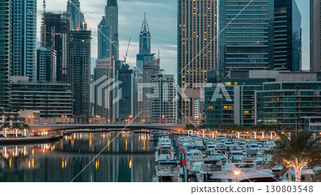 Dubai Marina towers and canal in Dubai night to day timelapse 130803548