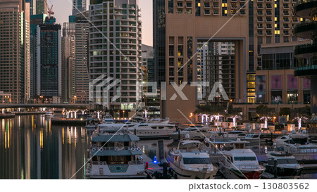 Dubai Marina towers and canal in Dubai night to day timelapse 130803562