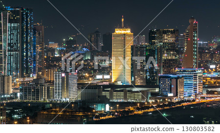 Dubai downtown skyline timelapse at night. Rooftop view of Sheikh Zayed road with numerous illuminated towers. Dubai downtown skyline timelapse at night. Rooftop view of Sheikh Zayed road with numerous illuminated towers. 130803582