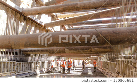 A large huge ditch pit tunnel timelapse at the construction site of the underground metro station line. A large huge ditch pit tunnel timelapse at the construction site of the underground metro station line. 130803691