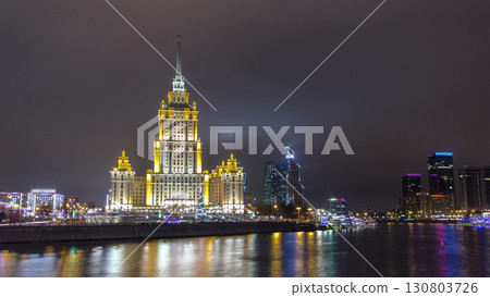 Hotel Ukraine winter night timelapse hyperlapse with bridge over Moscow River. Hotel Ukraine winter night timelapse hyperlapse with bridge over Moscow River. 130803726