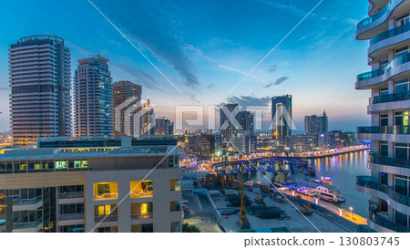 An Aerial view of Dubai Marina towers in Dubai day to night timelapse 130803745