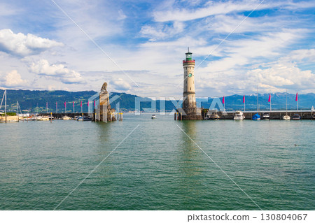 Lighthouse and Bavarian Lion at the harbour entrance in Lindau, Germany. Antique bavarian town at Lake Constance (Bodensee) 130804067