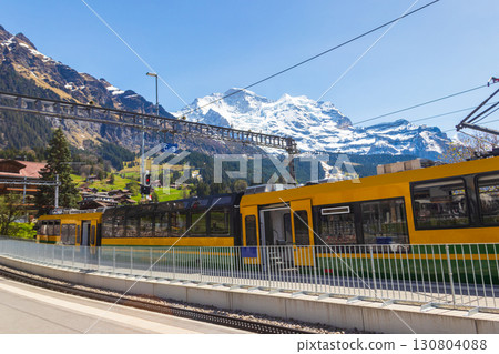 Tourist train at the station in alpine Wengen village in Bernese Oberland, Switzerland 130804088