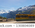 Tourist train at the station in alpine Wengen village in Bernese Oberland, Switzerland 130804089