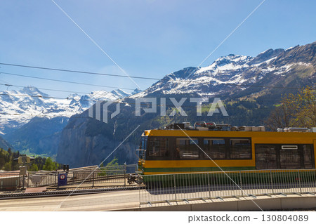 Tourist train at the station in alpine Wengen village in Bernese Oberland, Switzerland 130804089