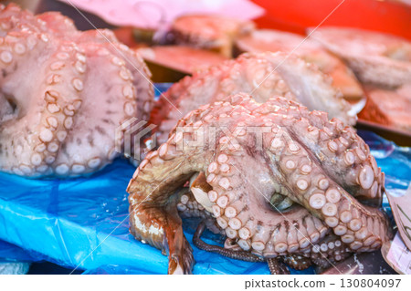 Fresh raw octopuses for sale in the fish market 130804097