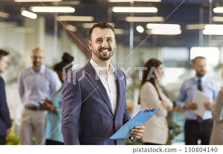 Portrait Of Happy And Successful Businessman Working In Office Portrait Of Happy And Successful Businessman Working In Office 130804140