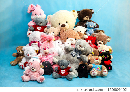 Orenburg, Russia - August 30, 2025 A pile of soft toys of different sizes on a blue background. Editorial Orenburg, Russia - August 30, 2025 A pile of soft toys of different sizes on a blue background. Editorial 130804402