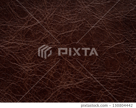 Brown leather natural texture, matte material, abstract background. Genuine quality empty pattern. 130804442