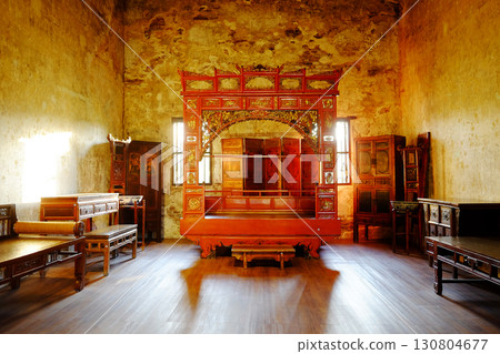 Vintage and rustic grunge concrete wall and wooden floor in bedroom with old bedchamber furniture of Chinese style 130804677