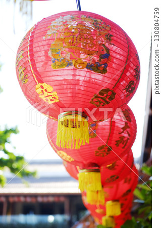 Beautiful traditional of red Chinese paper lantern with Chinese characters hanging in natural sunlight on Chinese New Year holiday Beautiful traditional of red Chinese paper lantern with Chinese characters hanging in natural sunlight on Chinese New Year holiday 130804759