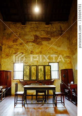 Vintage and rustic grunge concrete wall and wooden floor in literature room with old furniture of Chinese style in Bangkok of Thailand. Vertical photo Vintage and rustic grunge concrete wall and wooden floor in literature room with old furniture of Chinese style in Bangkok of Thailand. Vertical photo 130804781