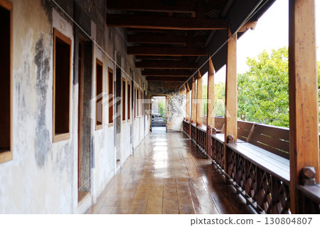Antique wooden terrace with vintage and rustic grunge concrete wall exterior of vintage house in natural sunlight in Bangkok of Thailand Antique wooden terrace with vintage and rustic grunge concrete wall exterior of vintage house in natural sunlight in Bangkok of Thailand 130804807