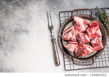 Raw Beef meat and veal bones for stew or goulash. grey background. top view 130805022