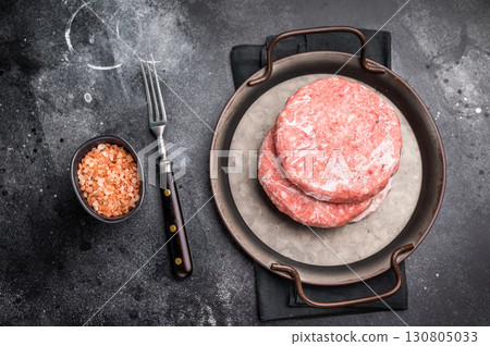 Frozen Meat cutlet, mincemeat of pork and beef for burgers. black background. top view 130805033