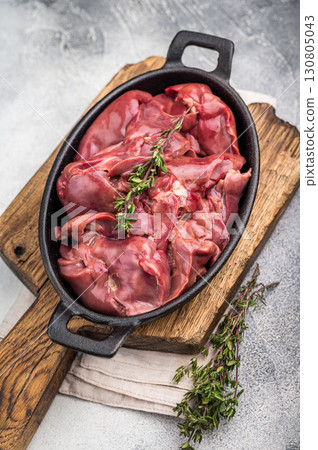 Freshly sourced poultry liver, chicken offals waiting to be transformed into a delicious dish. grey background. top view 130805043