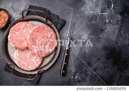 Frozen Meat cutlet, mincemeat of pork and beef for burgers. black background. top view 130805059