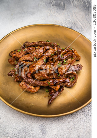 Asian food Teriyaki beef meat on a plate on grey background. top view Asian food Teriyaki beef meat on a plate on grey background. top view 130805089