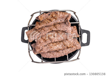 Flavorful yakiniku with juicy wagyu beef slices cooked right at the table. isolated on white background. top view 130805138