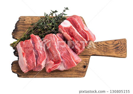 Fresh lamb rack rib pieces, mutton meat with thyme on wooden board isolated on white background. top view Fresh lamb rack rib pieces, mutton meat with thyme on wooden board isolated on white background. top view 130805155